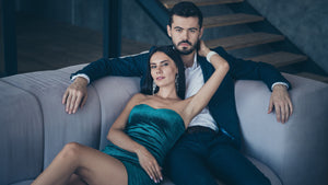 Confident man on couch with woman